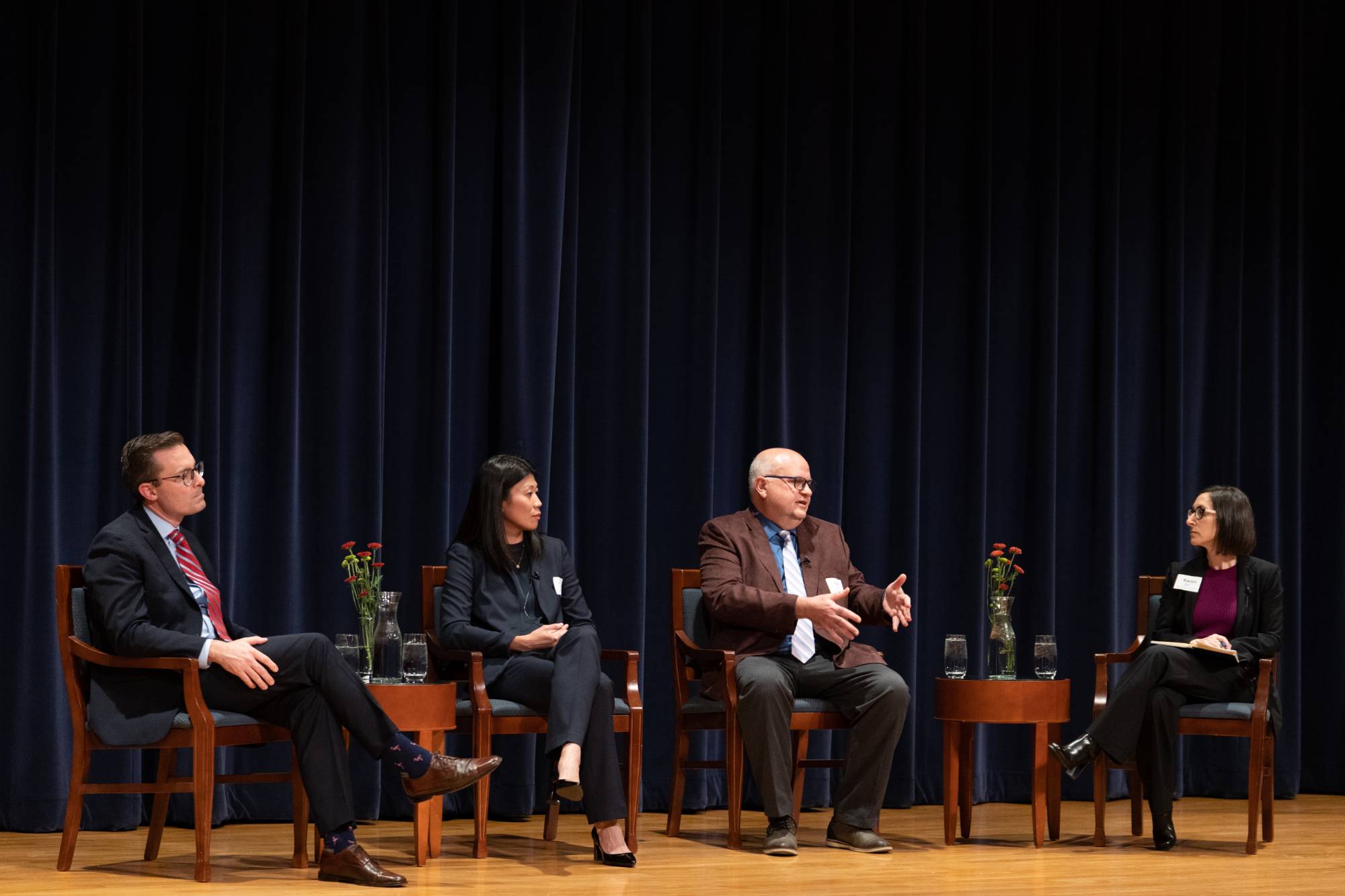 people speaking on a panel